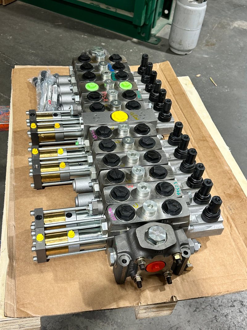Rebuilt hydraulic valve manifold and cylinder assembly