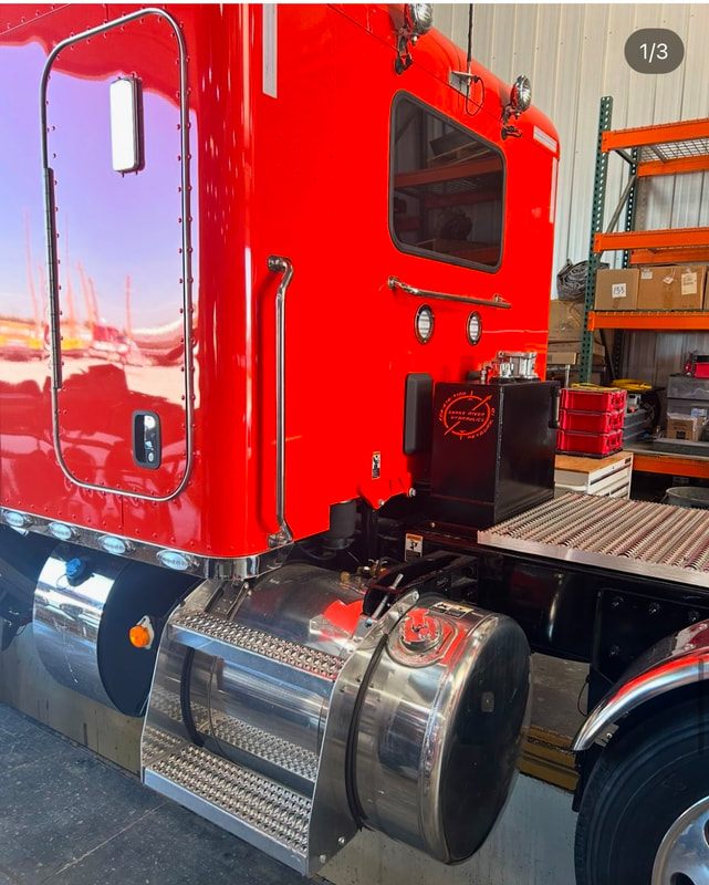 Hydraulic wet kit installed behind a semi-truck cab